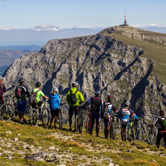 group of bikers admiring costila in bucegi mountains