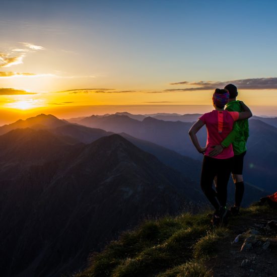 lovely couple admiring the sunset in the Fagaras mountain range