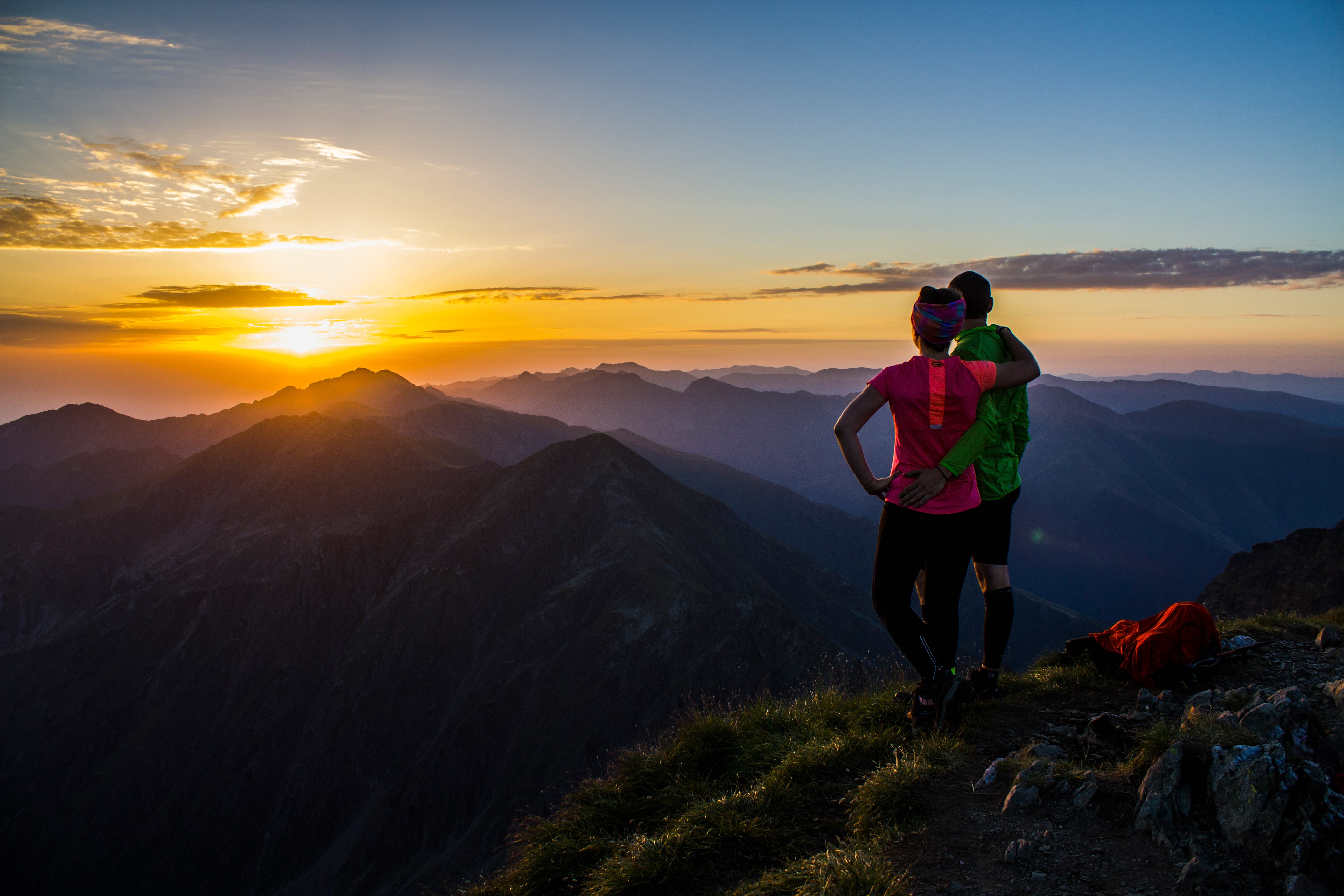 lovely couple admiring the sunset in the Fagaras mountain range