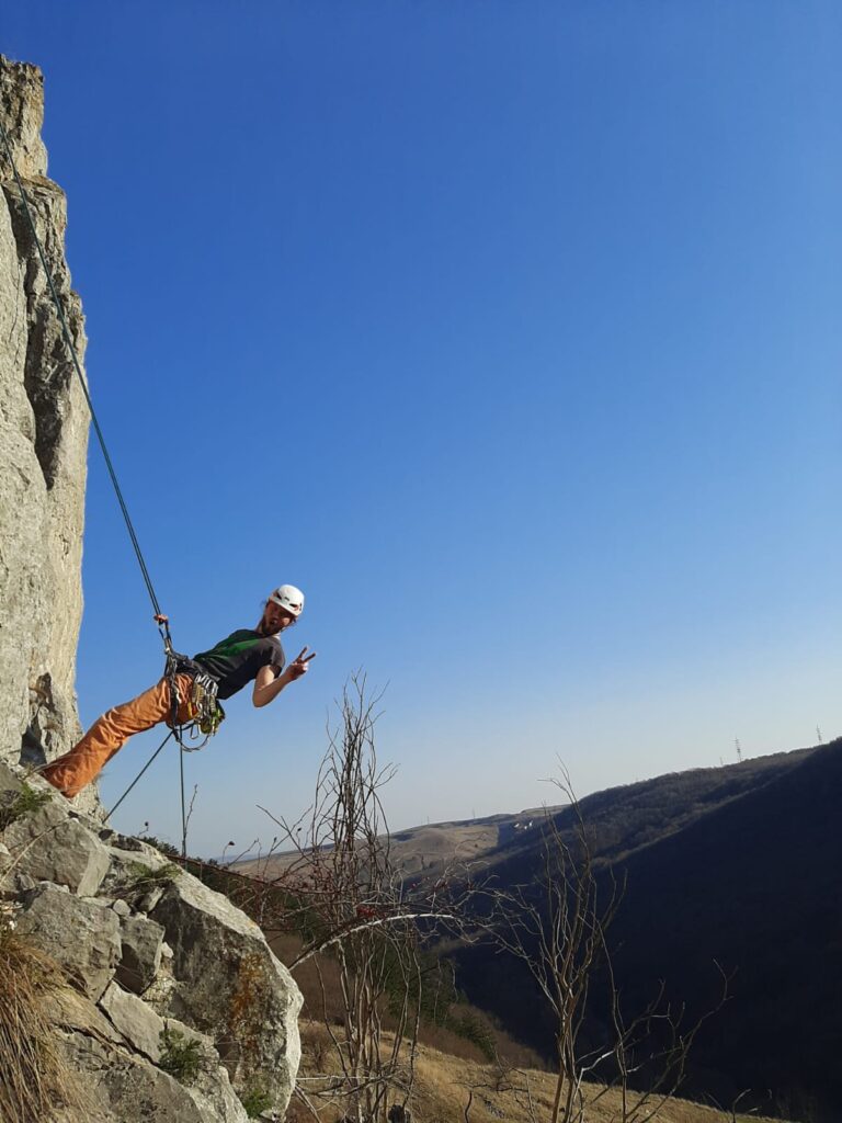 climber rapelling after finishing a route