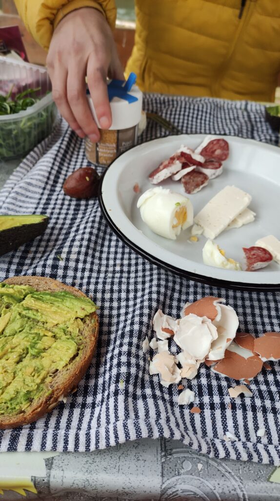 picnic , bread with avocado, fried eggs and cheese